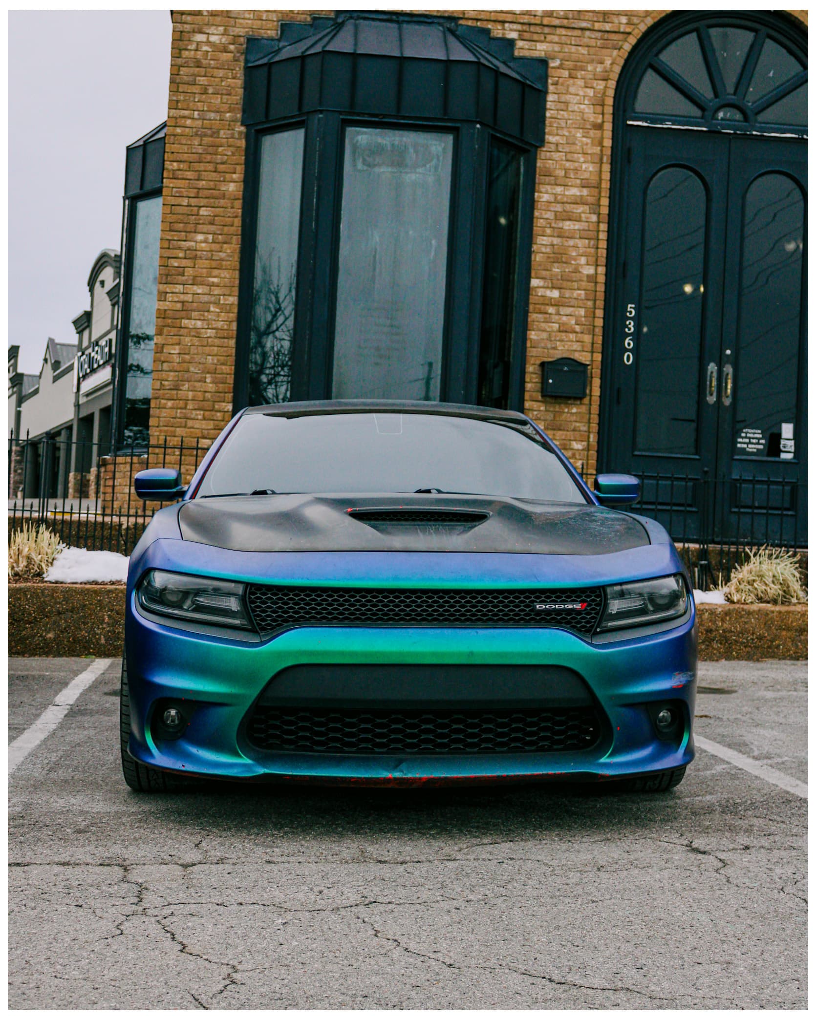 Blue-green chameleon Dodge Charger front view