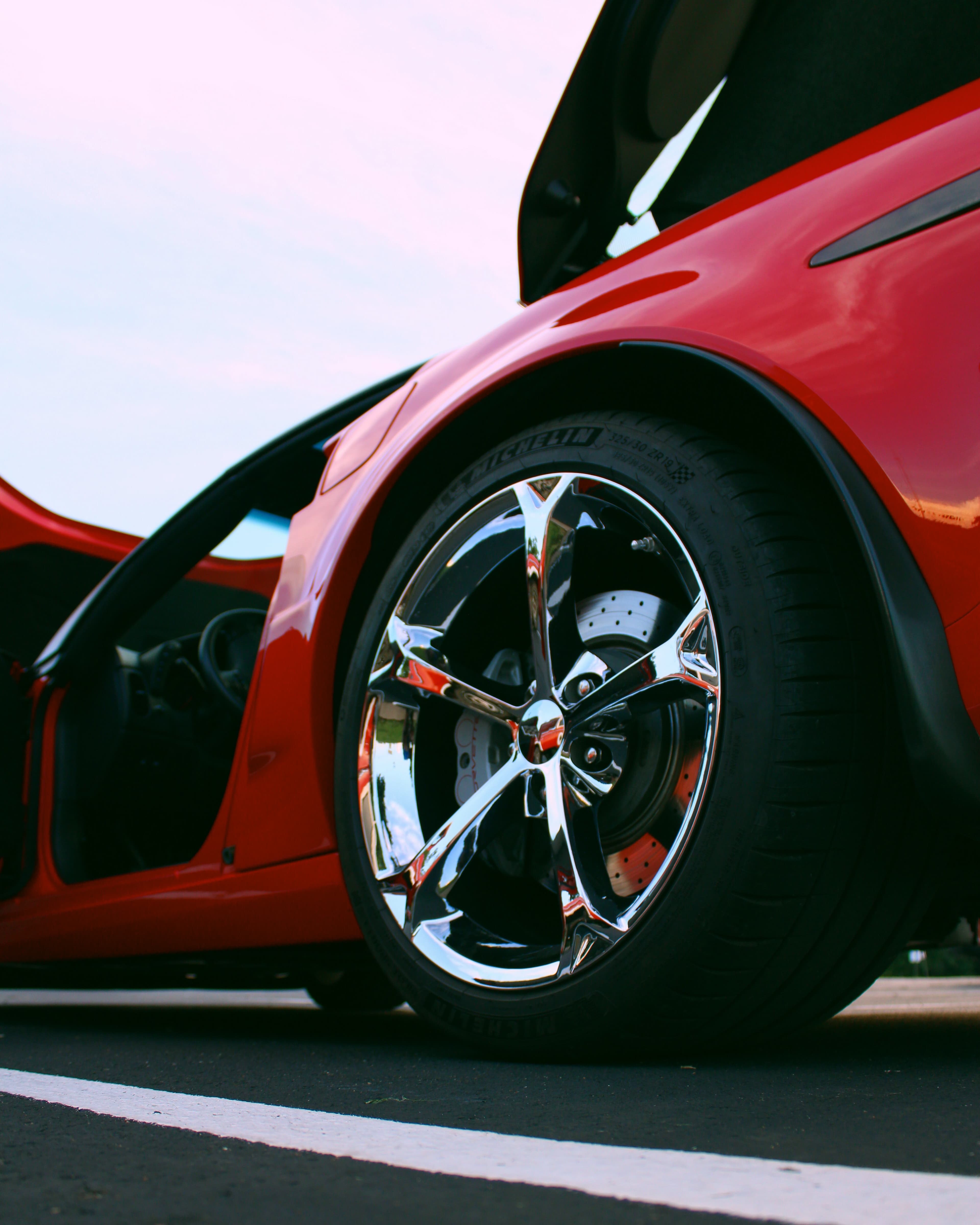 Red Ford Mustang wheel and fender detail